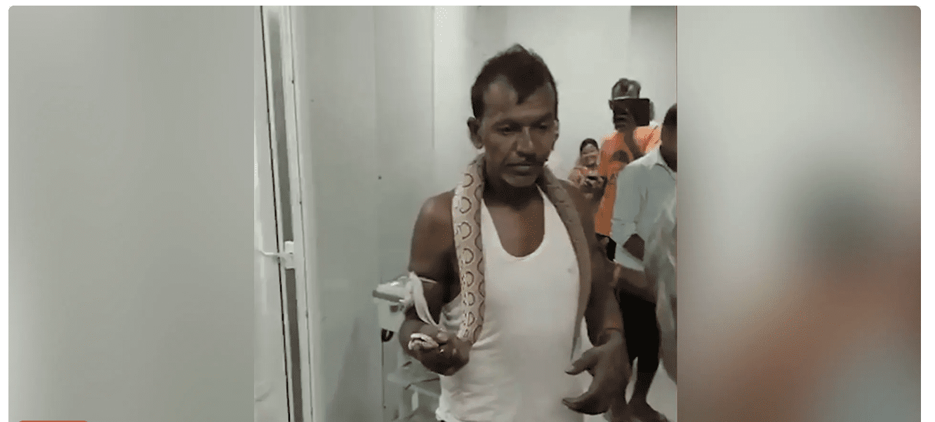 Man with snake in hospital